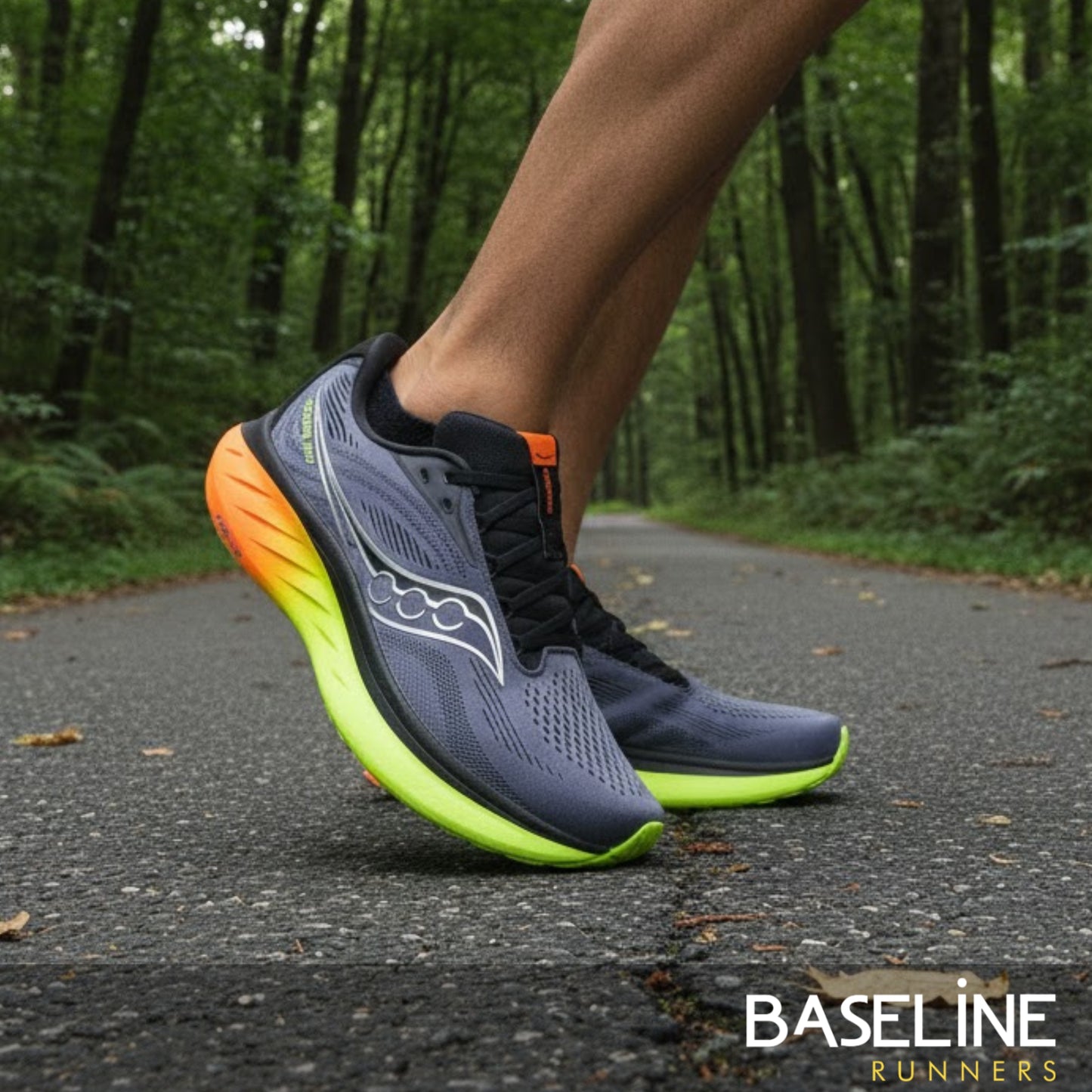 Person wearing Saucony running shoes on a forest path with 'Baseline Runners' branding.