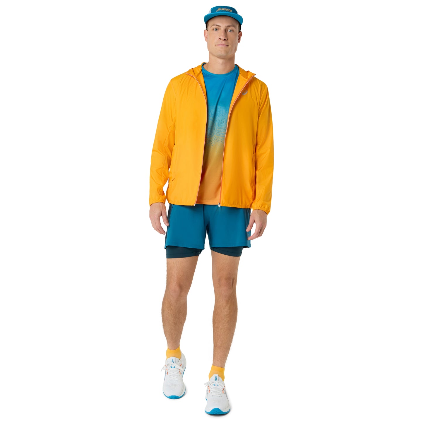 Person wearing blue and yellow Asics running shirt on a white background