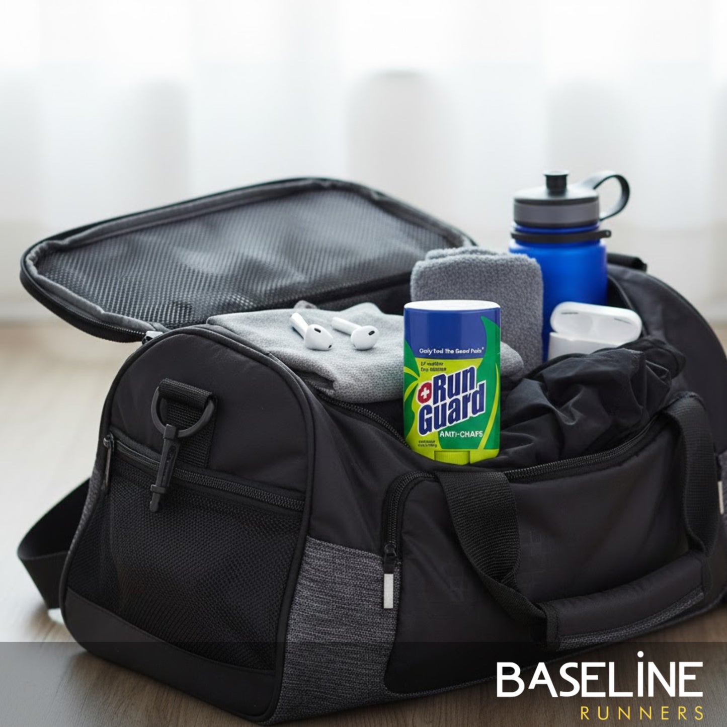Black duffel bag with gym items including a water bottle, towel, and 'Run Guard' canister on a light background.