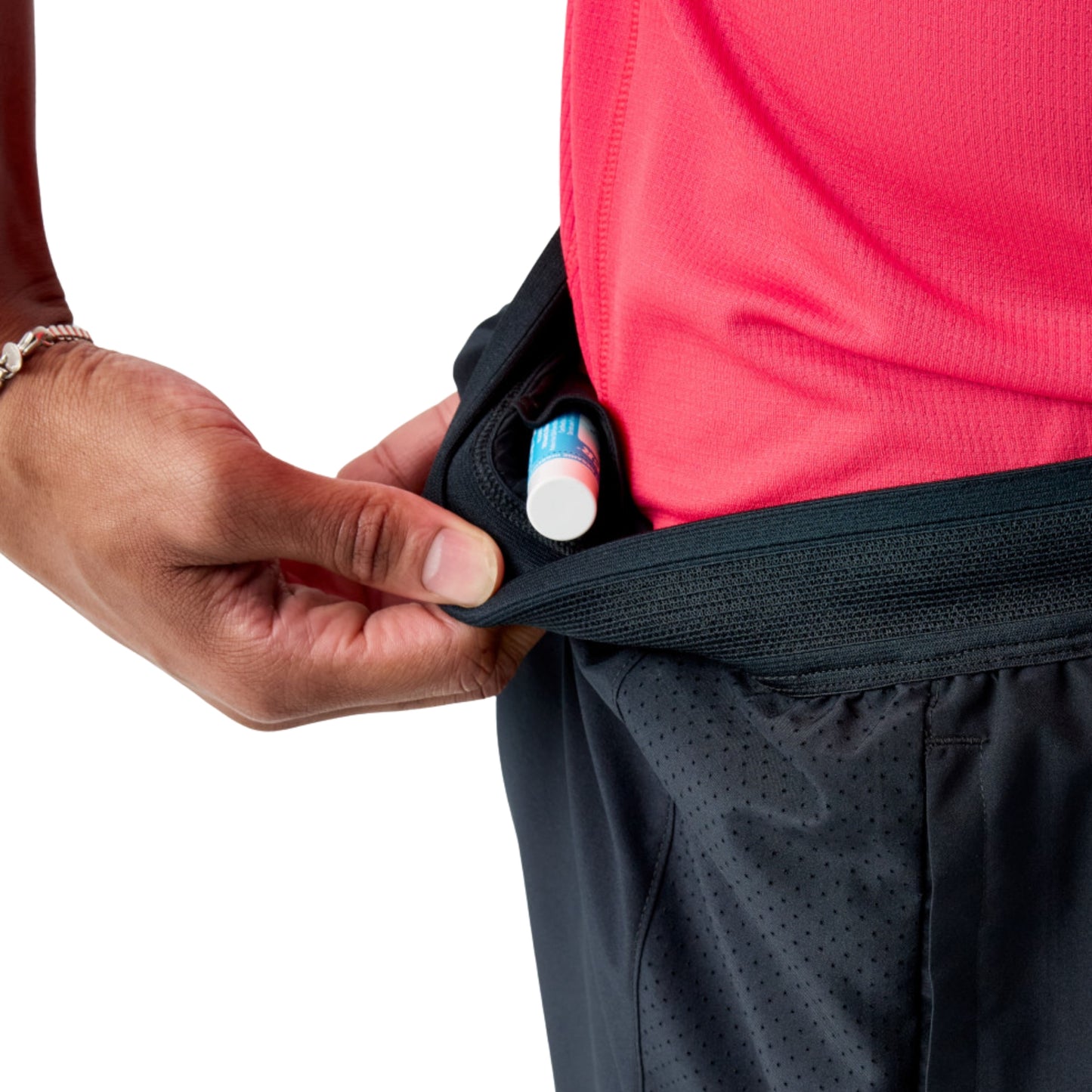 Man wearing black Brooks running shorts on a white background