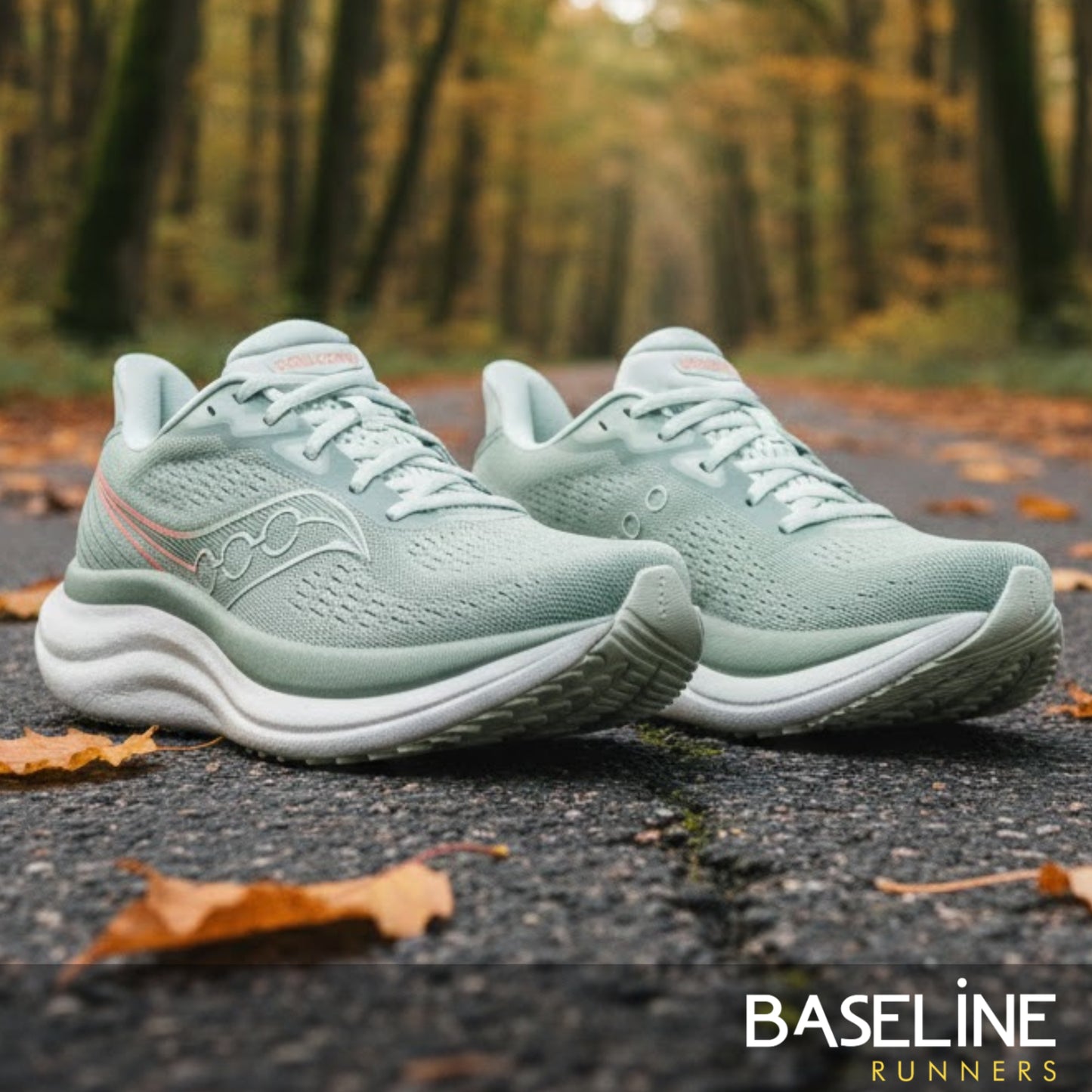 Pair of light green running shoes on a forest path with 'Baseline Runners' branding.