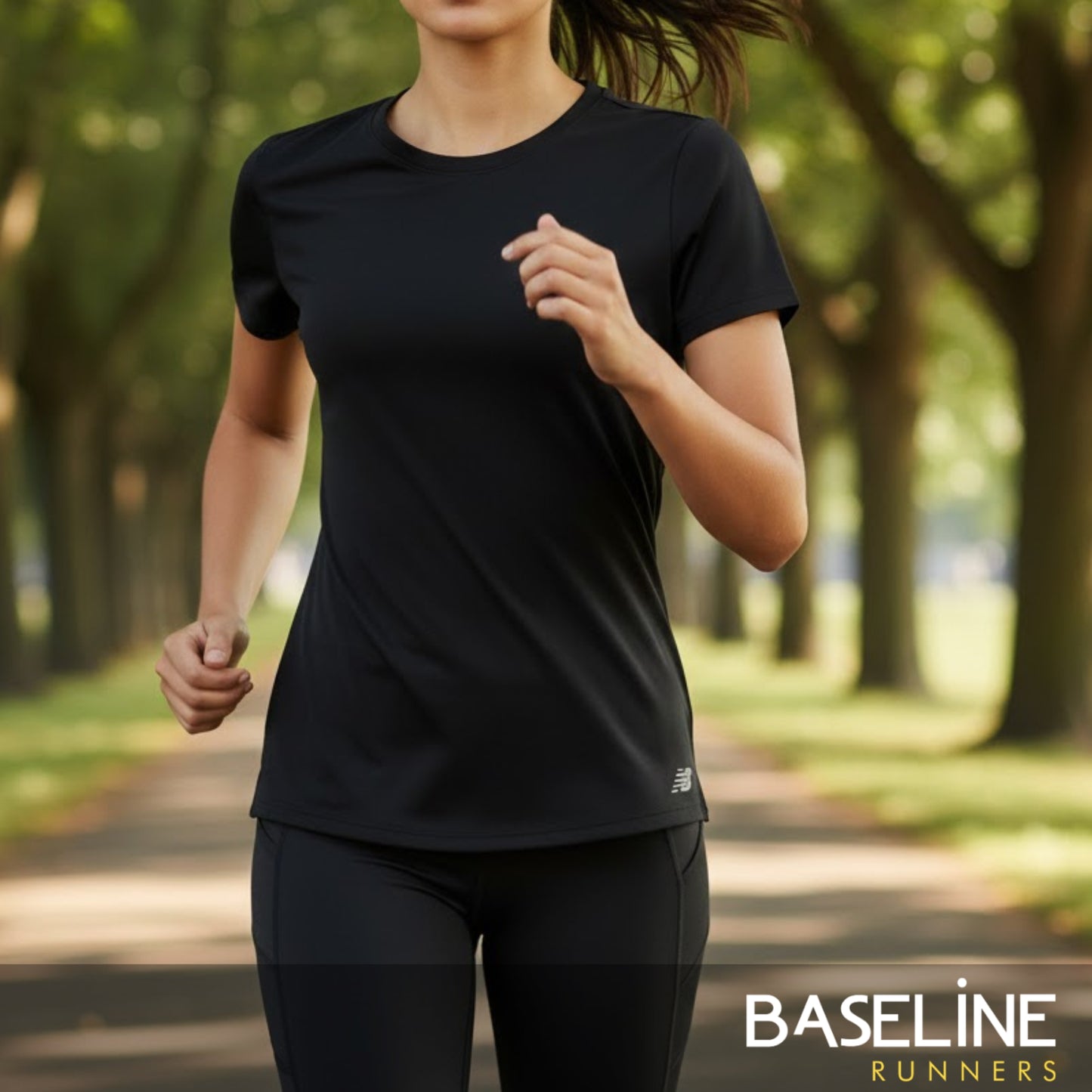 Person wearing a black athletic outfit running in a park with 'Baseline Runners' branding.
