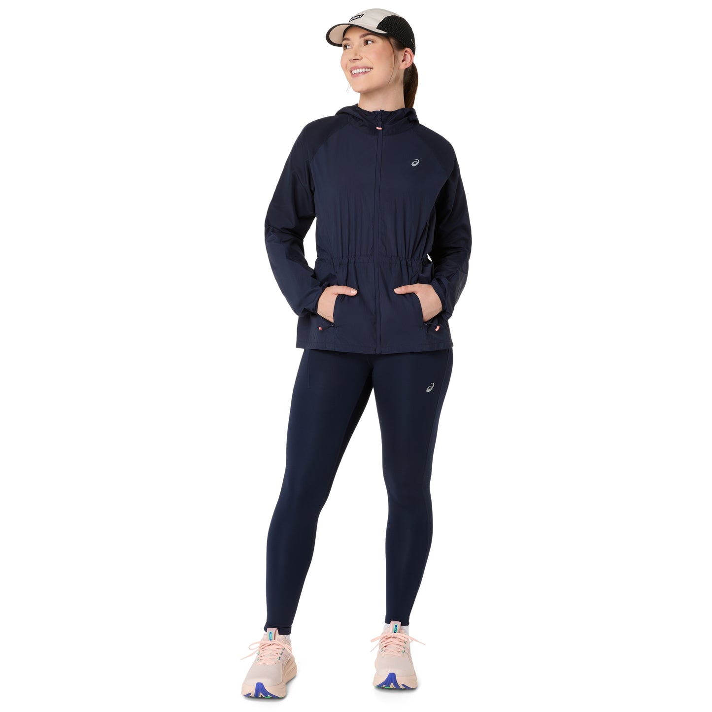 Woman wearing a navy blue outfit on a white background