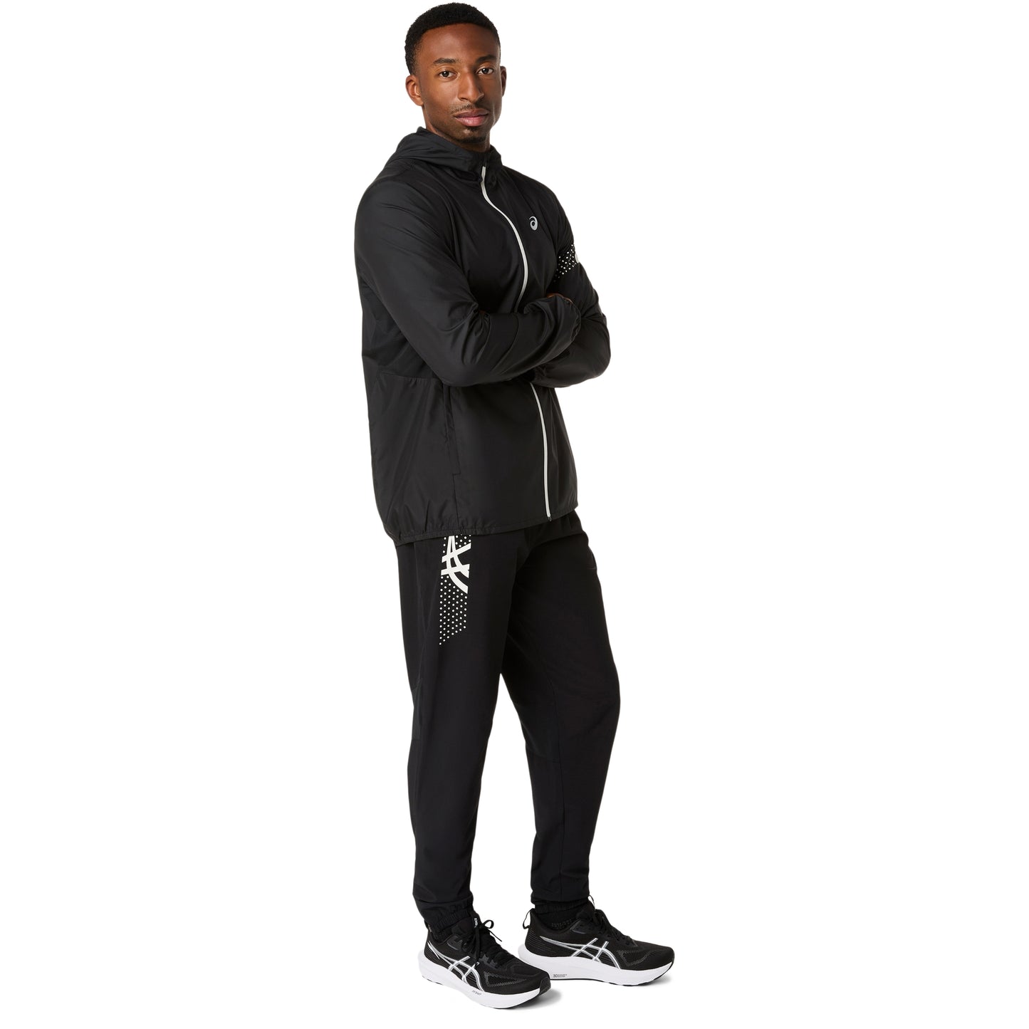 Person wearing a black athletic outfit on a white background