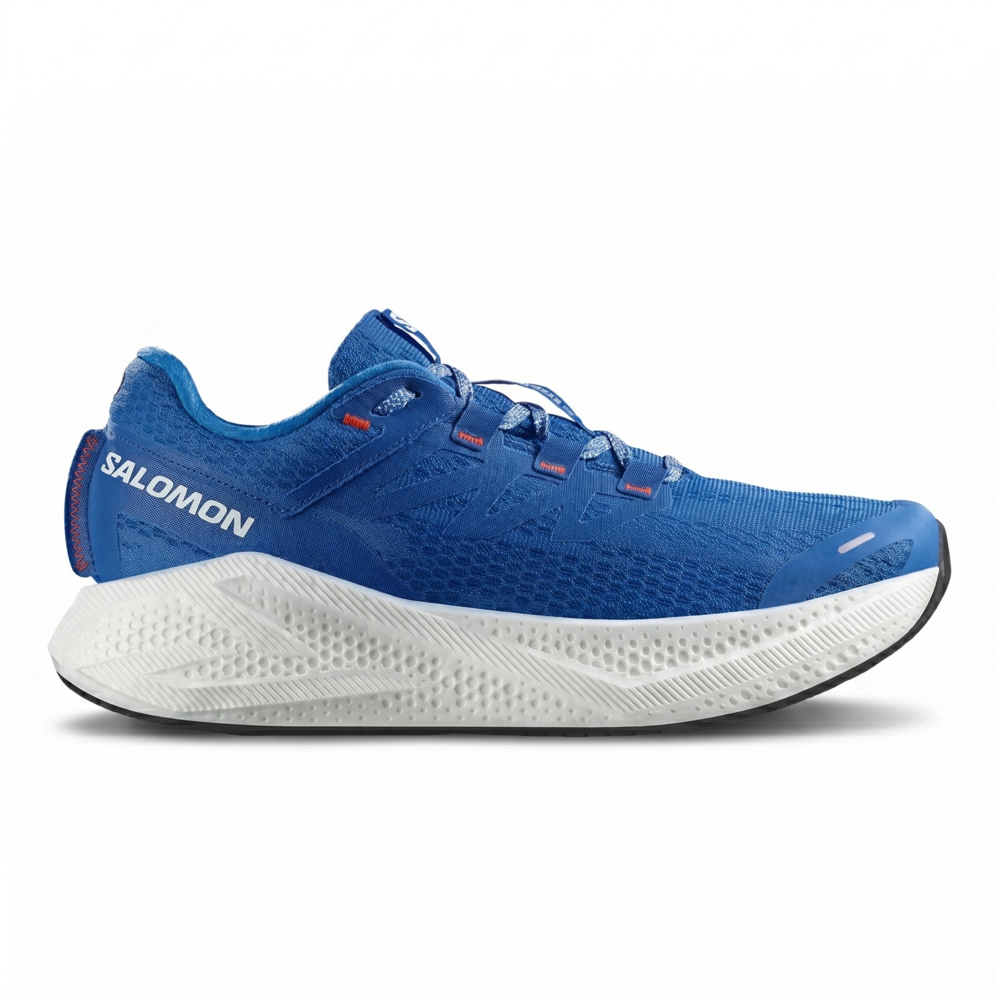 Blue Salomon running shoe with white sole on a white background