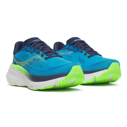 Blue and green Saucony running shoes with green soles on a white background