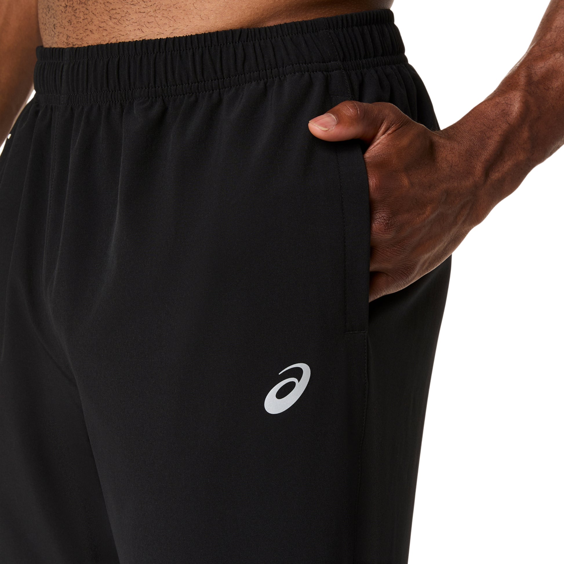 Close-up of a person with his hands in his pockets ona white background