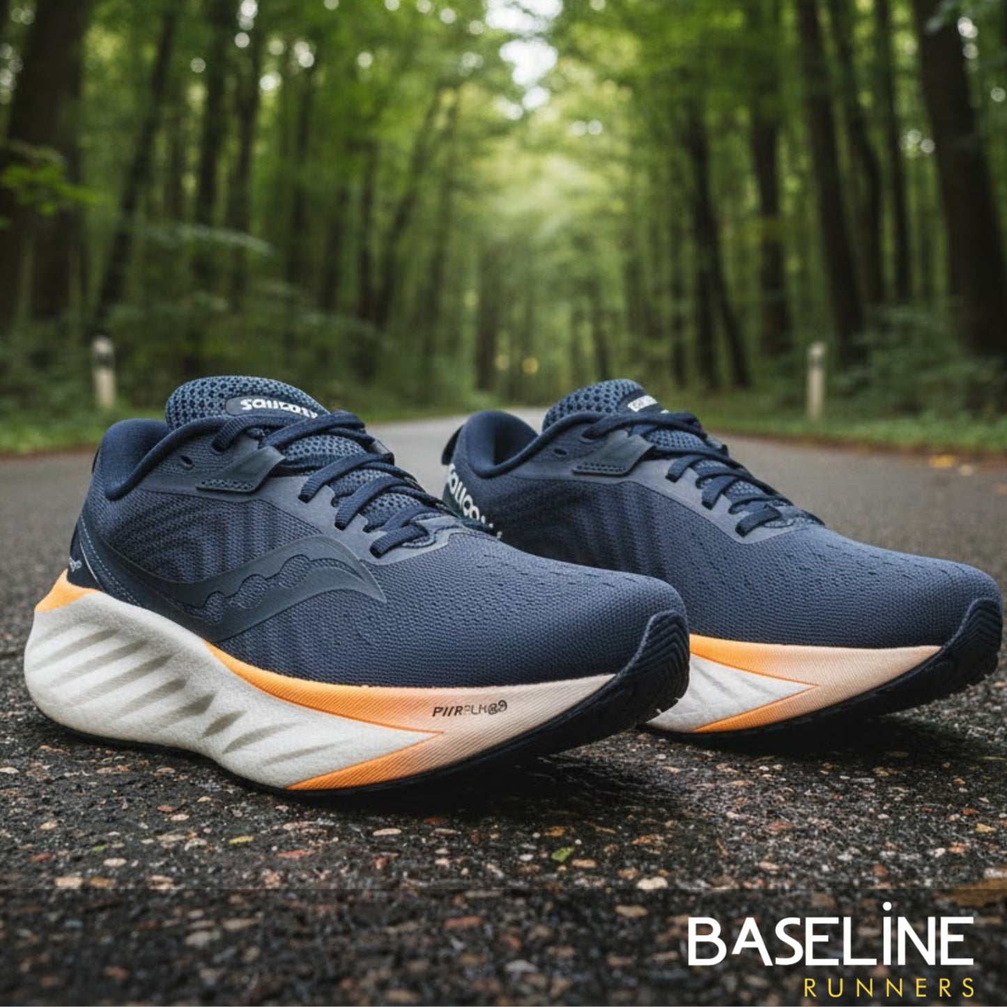 Dusk Saucony running shoe being presented on a paved road with a forest background 