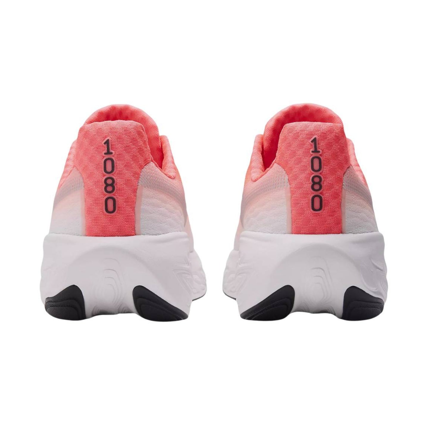 Pair of white New Balance running shoes with pink heel cups and black soles on a white background