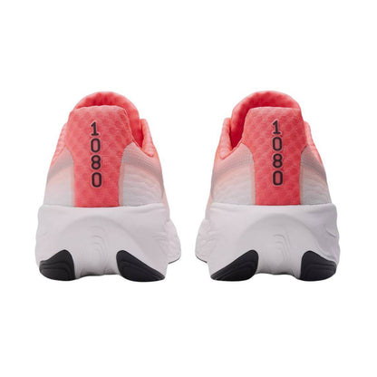 Pair of white New Balance running shoes with pink heel cups and black soles on a white background