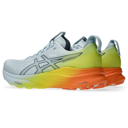 Pair of White and yellow Asics running shoe with orange accents on a white background
