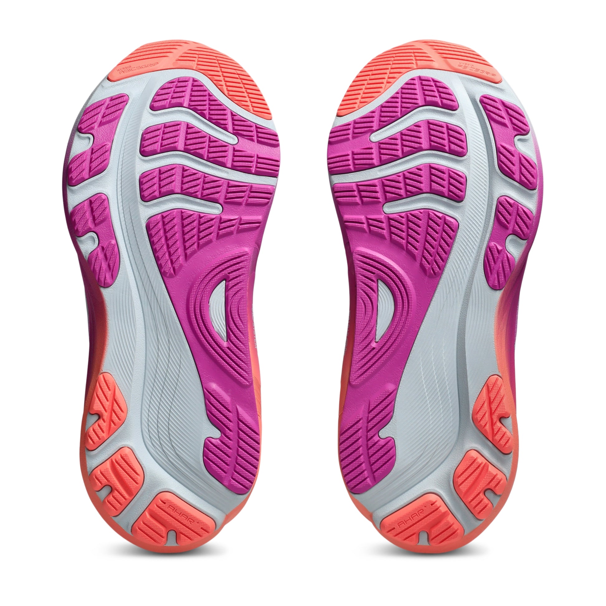 Close-up of pink and orange athletic shoe soles on a white background