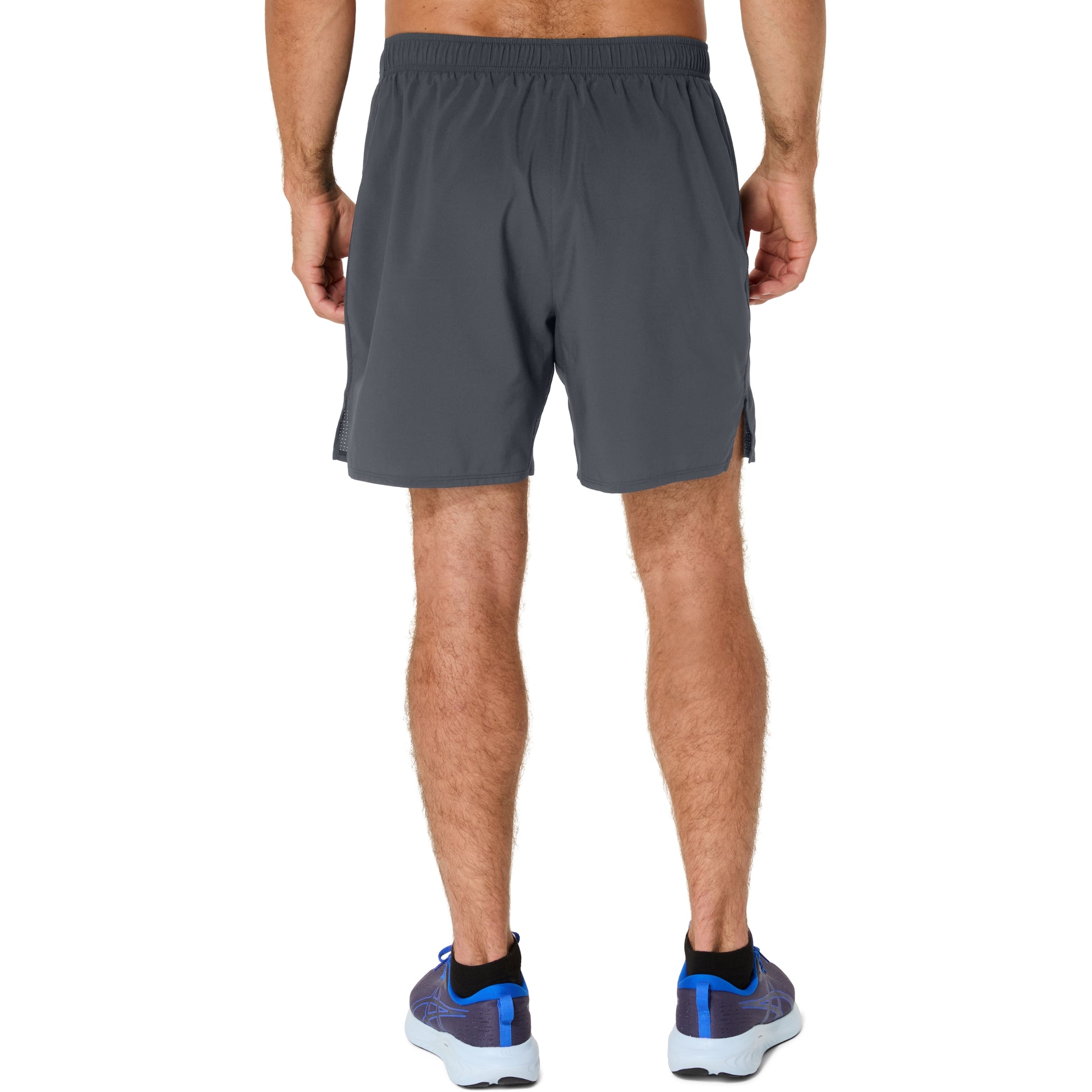 Person wearing gray running shorts on a white background