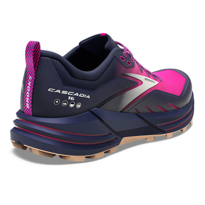 Navy and pink running shoe with 'Brooks' branding on a white background