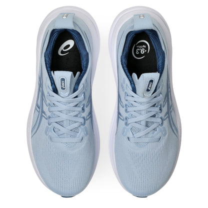 Light blue Asics running shoes with white soles on a white background