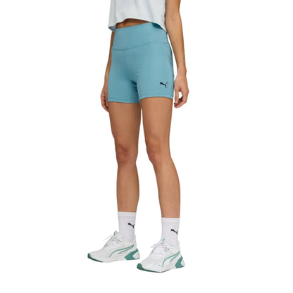 Person wearing light blue Puma tight with a visible brand logo on a white background