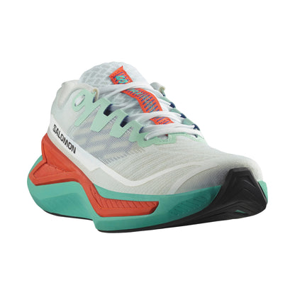 Salomon running shoe with white, green, and orange design on a white background