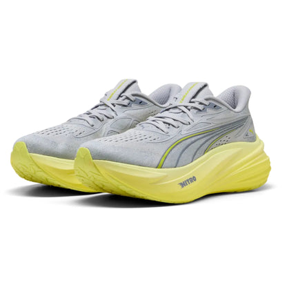 Gray running shoes with yellow soles on a white background