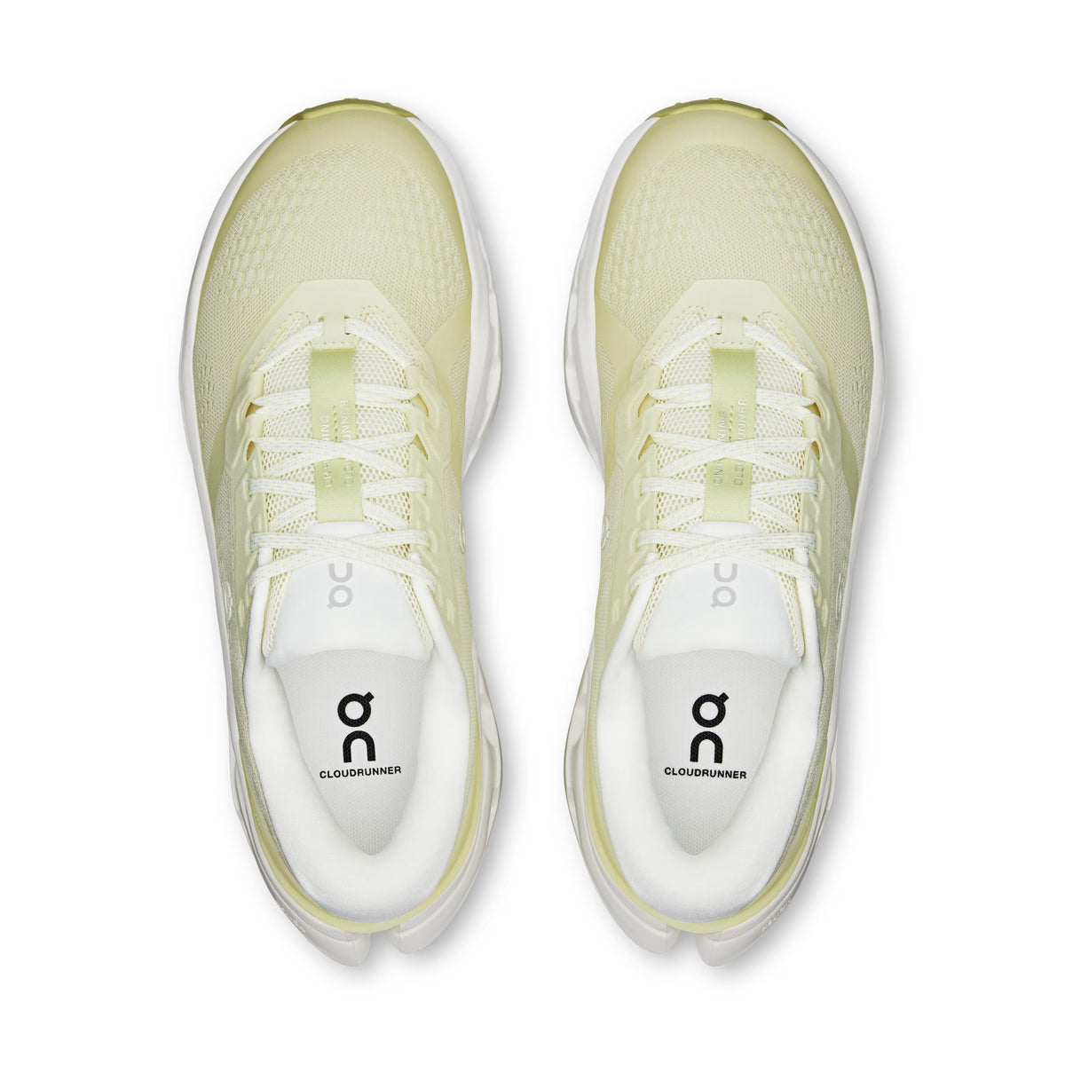 Pair of light green running shoes with 'on' branding on a white background