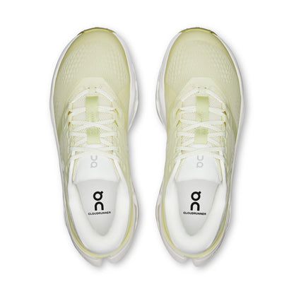 Pair of light green running shoes with 'on' branding on a white background