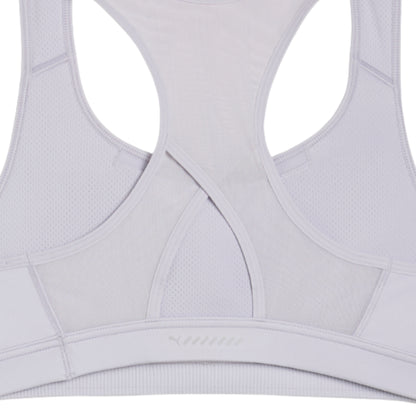 Close-up of a light gray sports bra with mesh panels on a white background