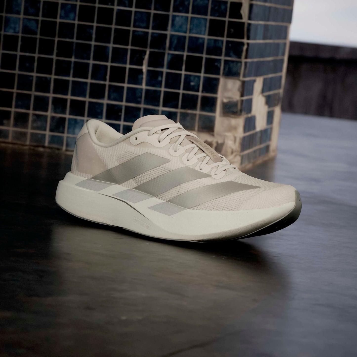 Beige Adidas running shoe 