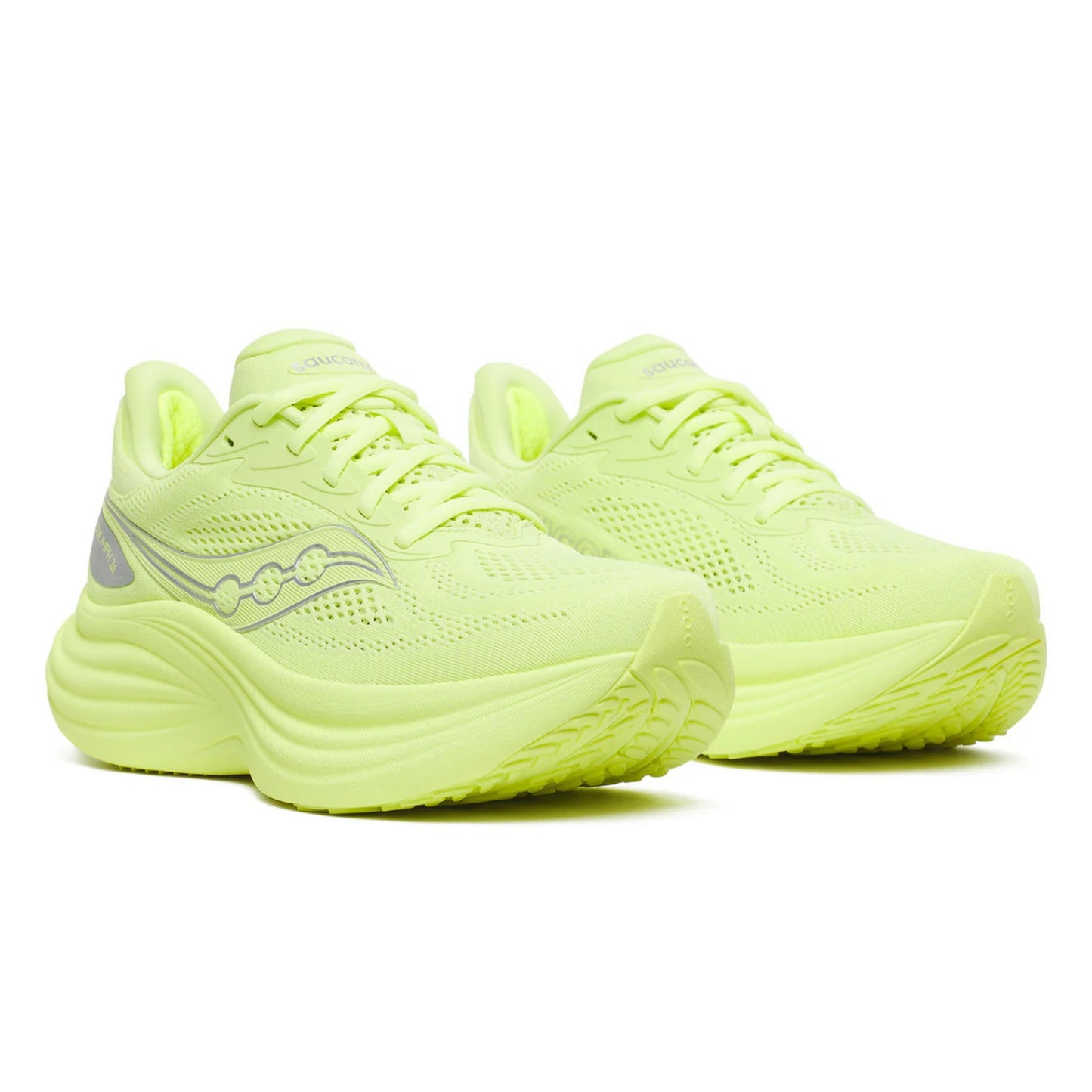 Pair of neon green Saucony running shoes on a white background