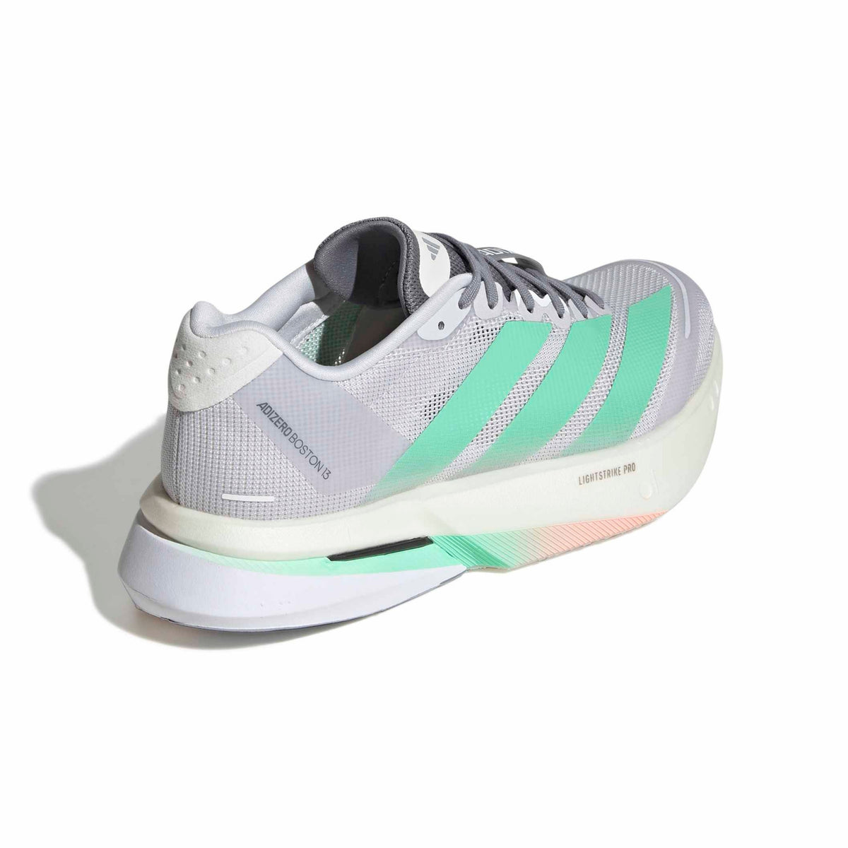 An Adidas Adizero Boston 13 running shoe in light gray and mint green, shown from a three-quarters angle on a white background with a soft shadow.