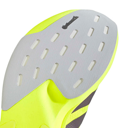 Close-up of a shoe sole with a brand logo on a white background