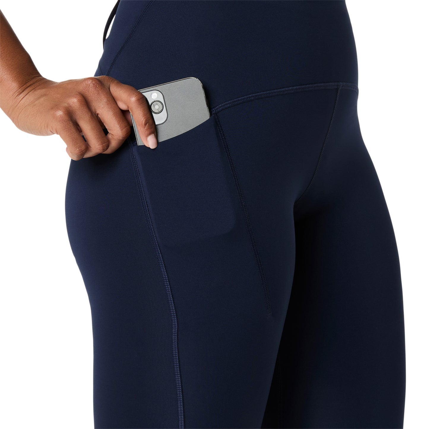 Navy Asics tights with a pocket holding a smartphone on a white background