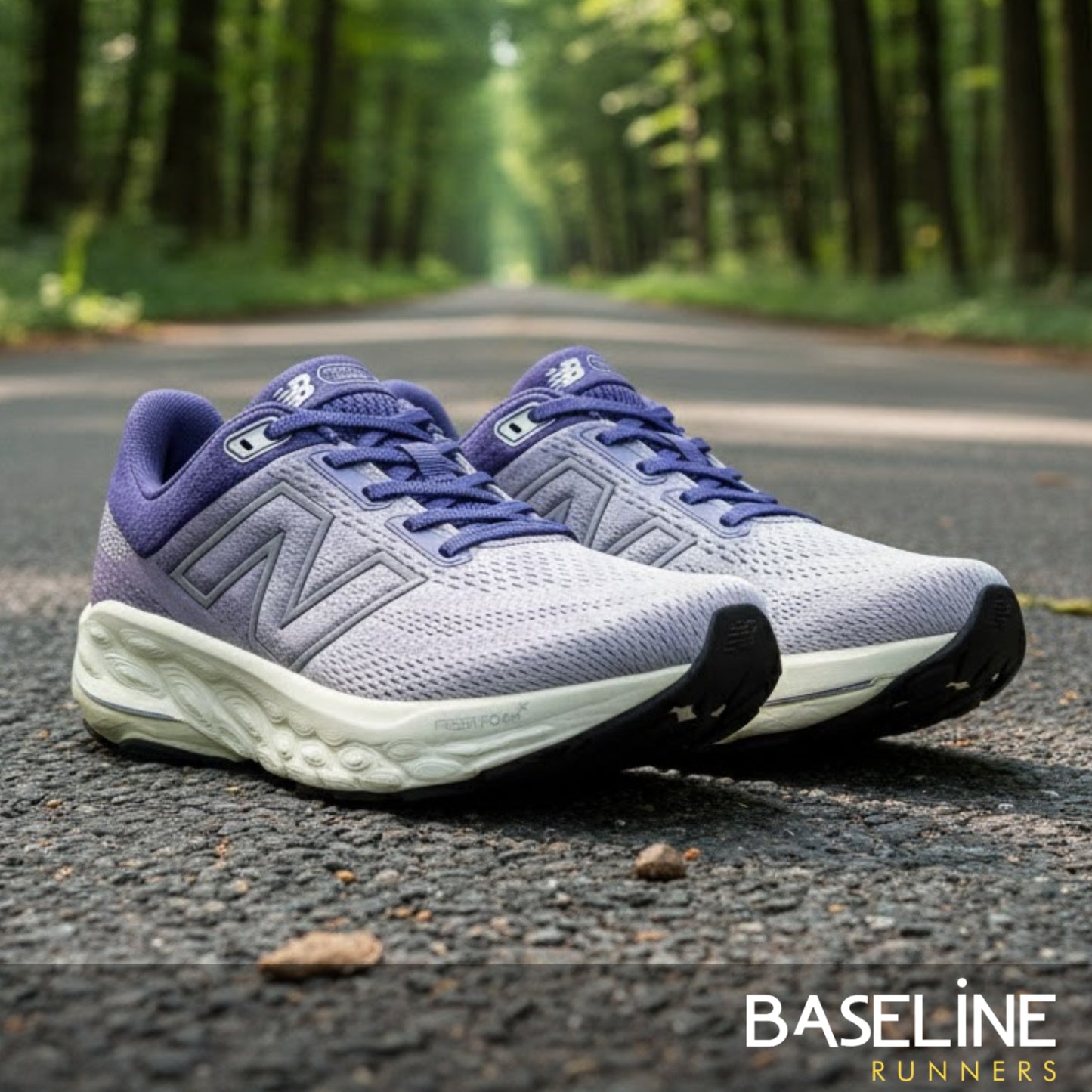 Pair of purple running shoes on a road with greenery in the background, featuring the 'Baseline Runners' brand.