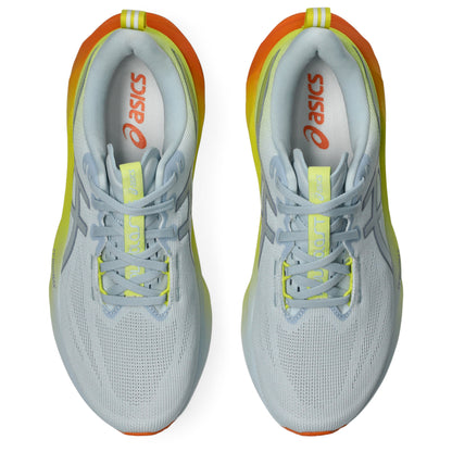 Pair of white and yellow Asics running shoes with orange accents on a white background