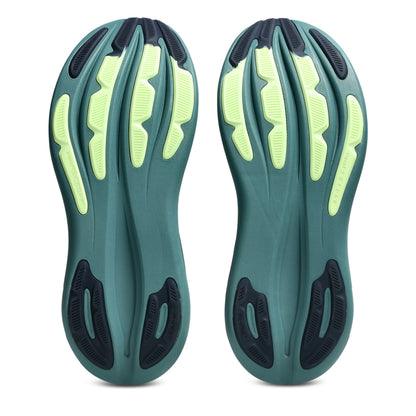 Bottom view of dark green asics running shoe soles on a white background