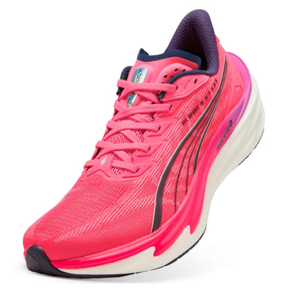 Pink Puma running shoe with white sole on a white background