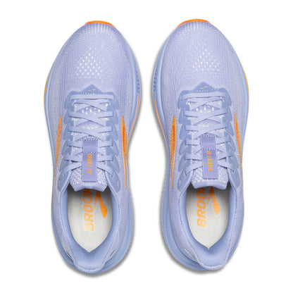 Pair of light blue running shoes with orange accents on a white background