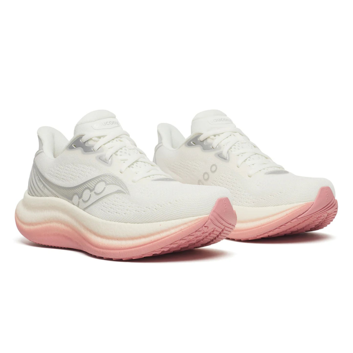 White Saucony running shoes with pink soles on a white background