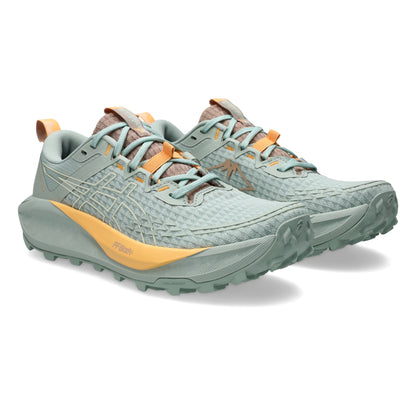 Asics running shoe with green and warm yellow tan accents 