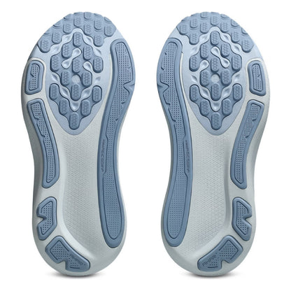 Close-up of the sole of a shoe with a textured design on a white background