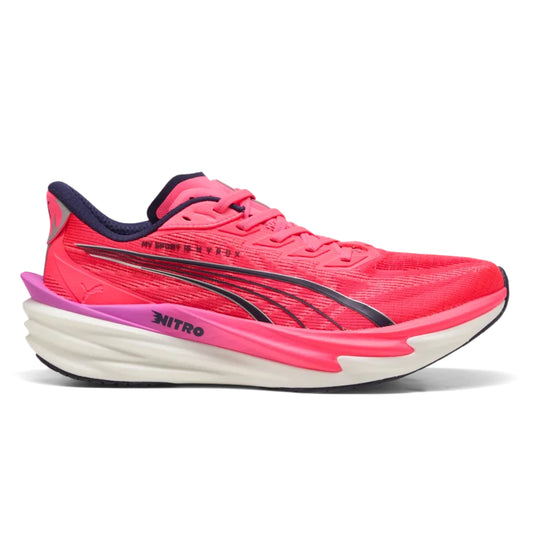 Pink Puma running shoe with white sole on a white background