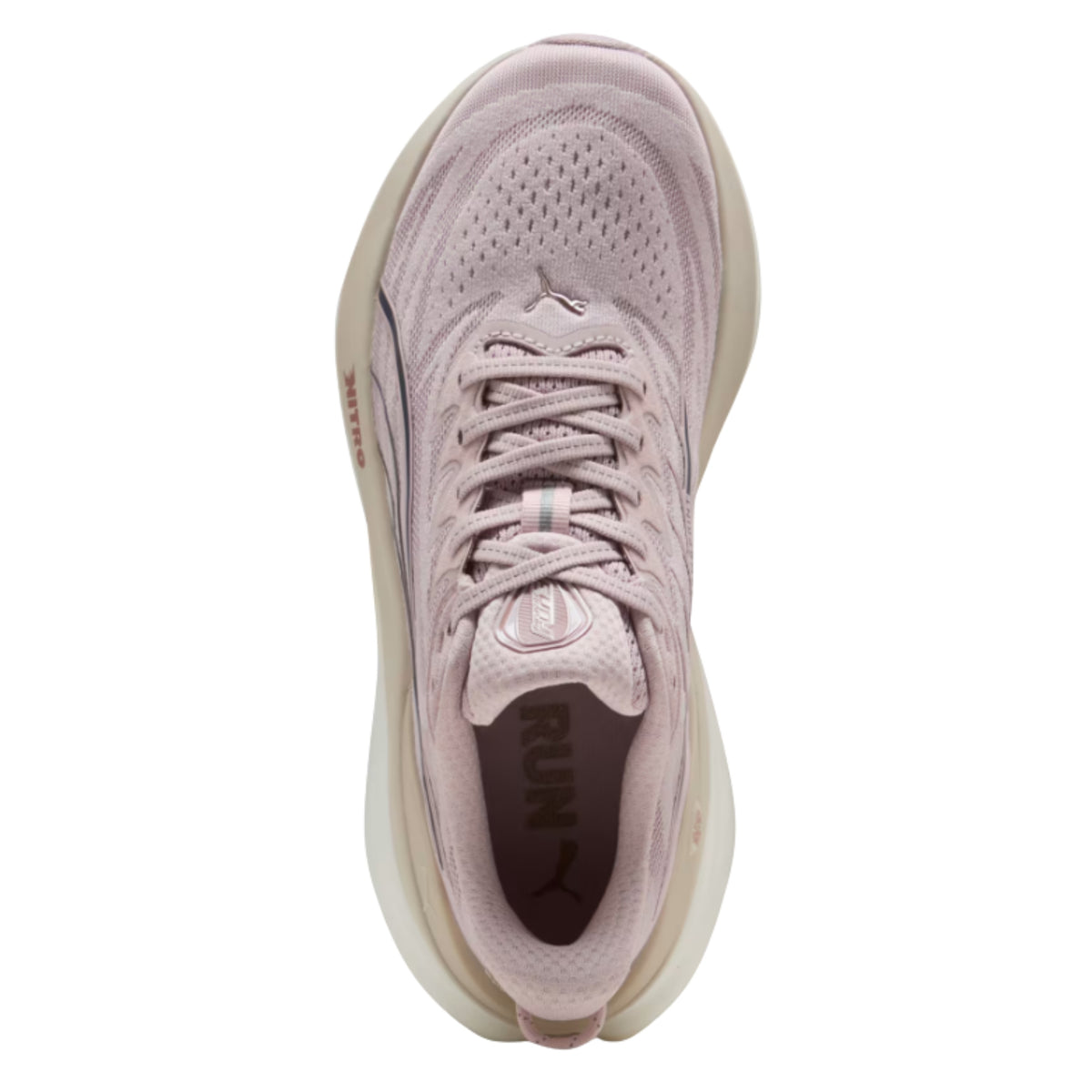 Light pink Puma running shoes on a white background