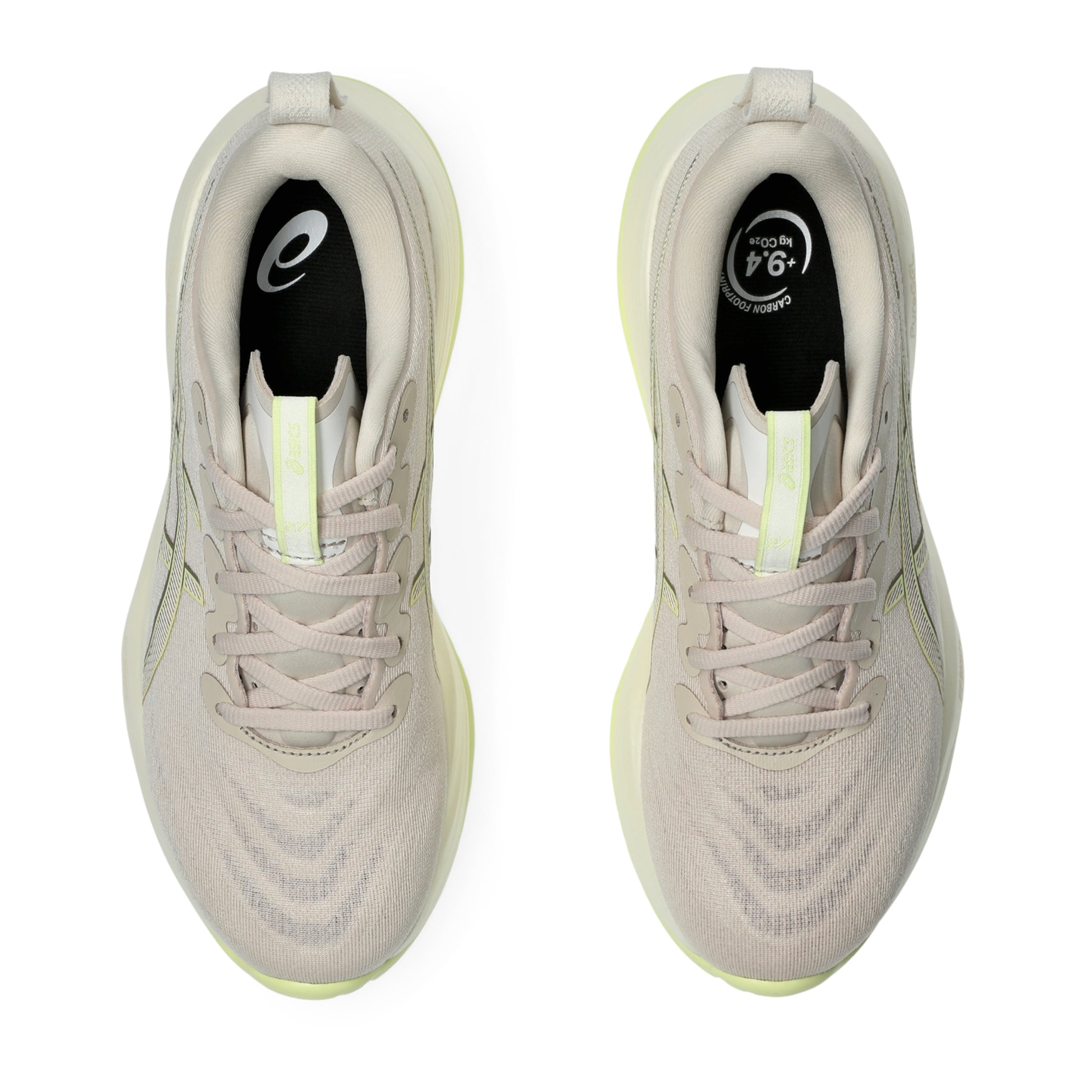 Pair of beige running shoes with black and yellow accents on a white background