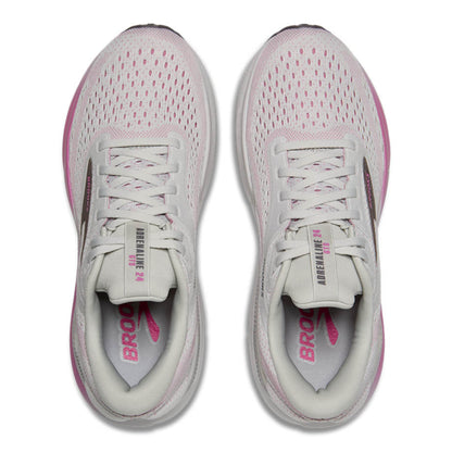 Pair of gray and pink running shoes on a white background