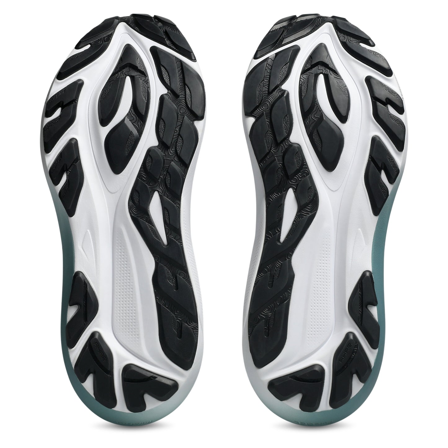Bottom view of a white and black sole running shoe on a white backround