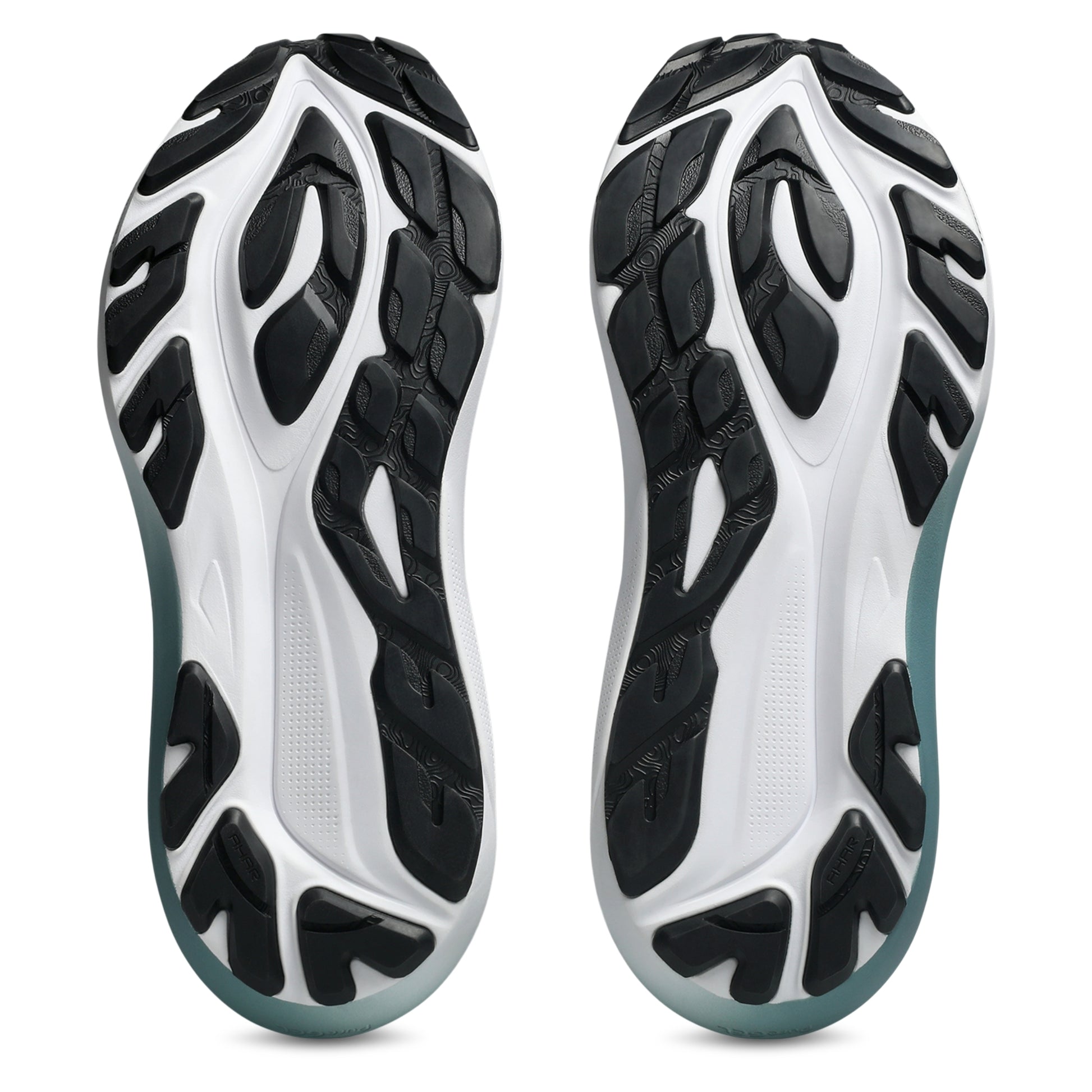 Bottom view of a white and black sole running shoe on a white backround