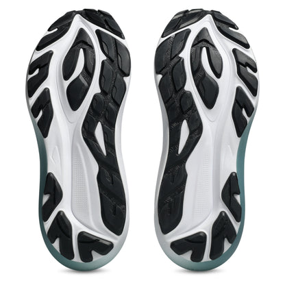 Bottom view of a white and black sole running shoe on a white backround