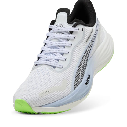 White Puma running shoe with green sole on a white background