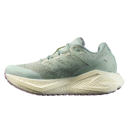 Light green Salomon running shoe with a white sole on a white background