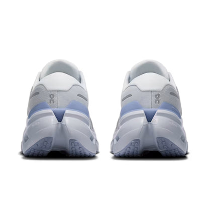 A pair of On running shoes shown from the back, featuring a white and light gray upper with light blue accents and a chunky white and blue sole.