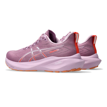 Pair of ube running shoes with orange accents on a white background