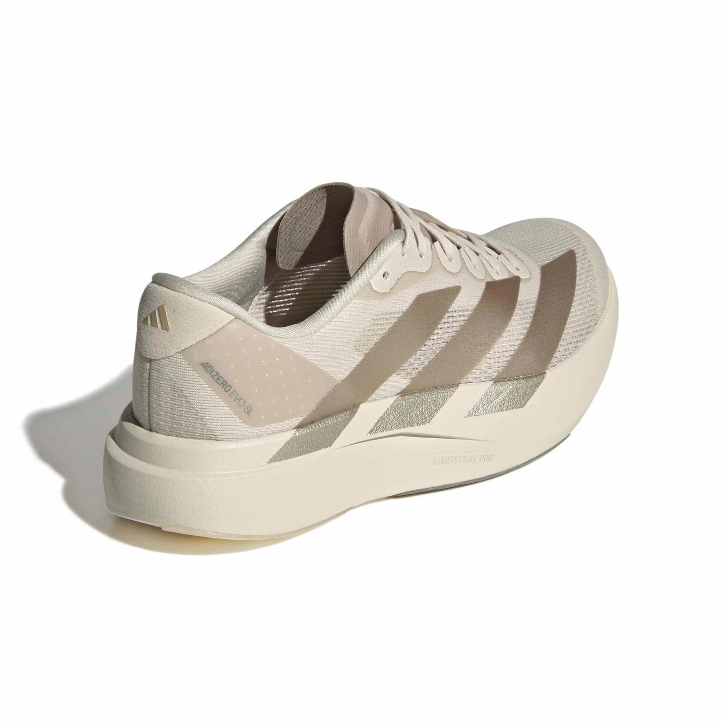Beige running shoe with Adidas logo on a white background